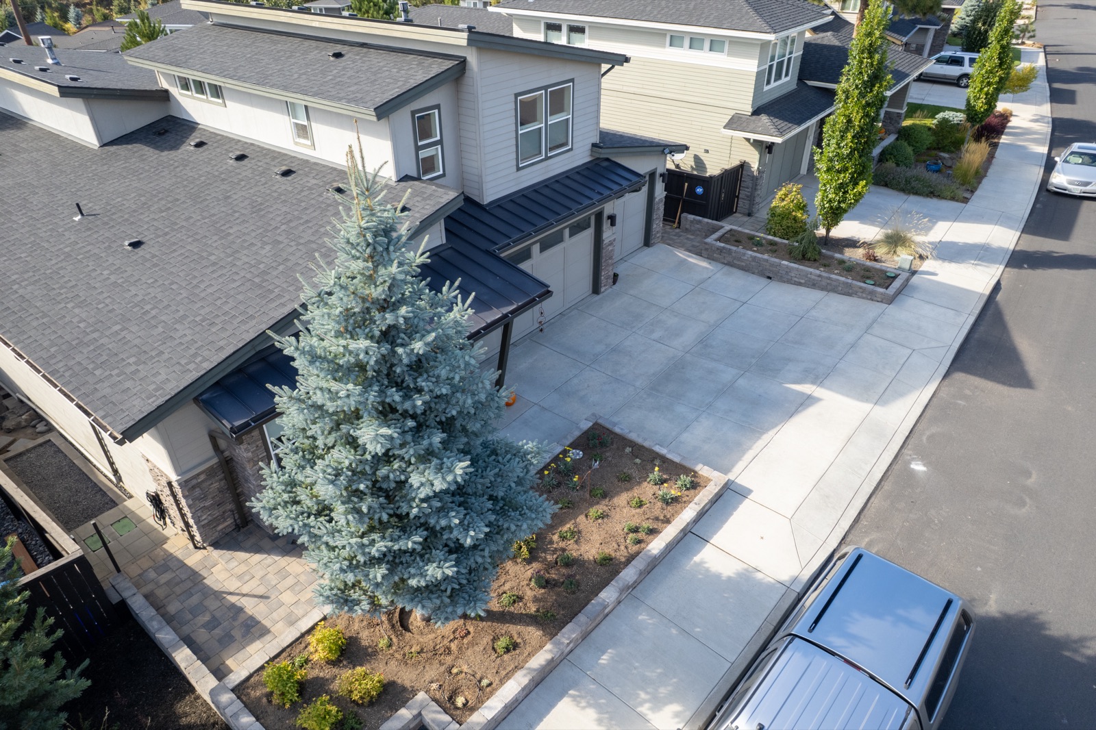 Drone view of a finished paver patio and retaining wall project in Bend, OR