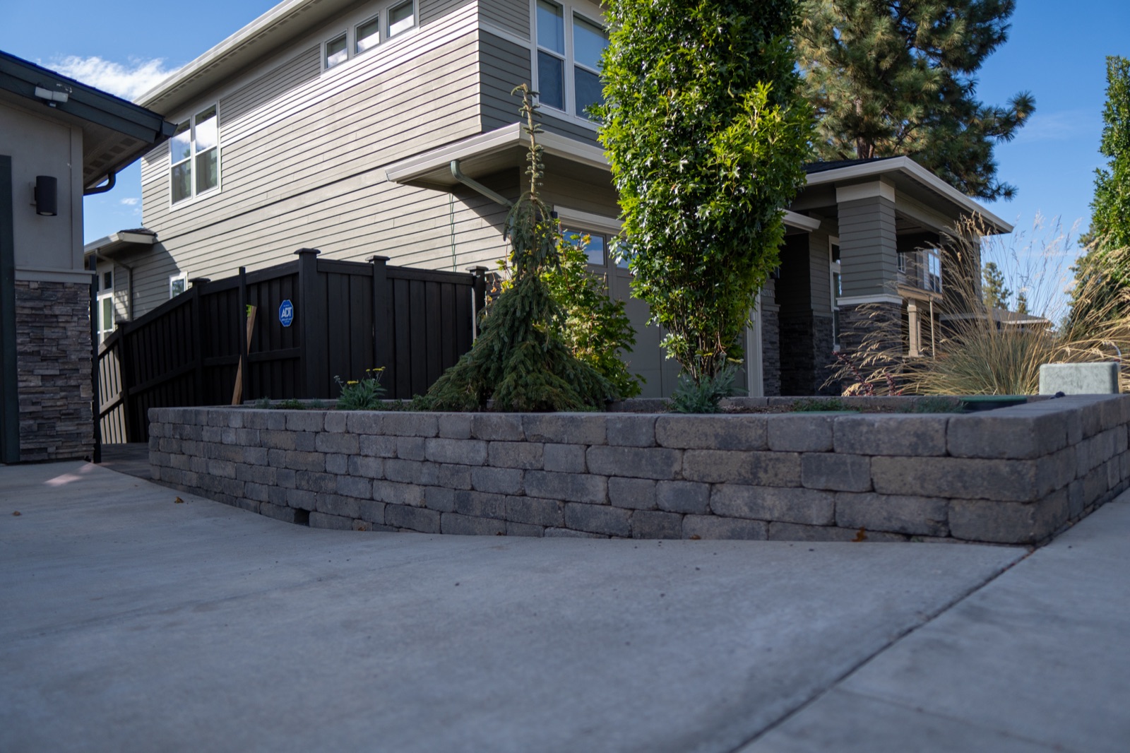 Long run of retaining wall beside the driveway, Bend OR
