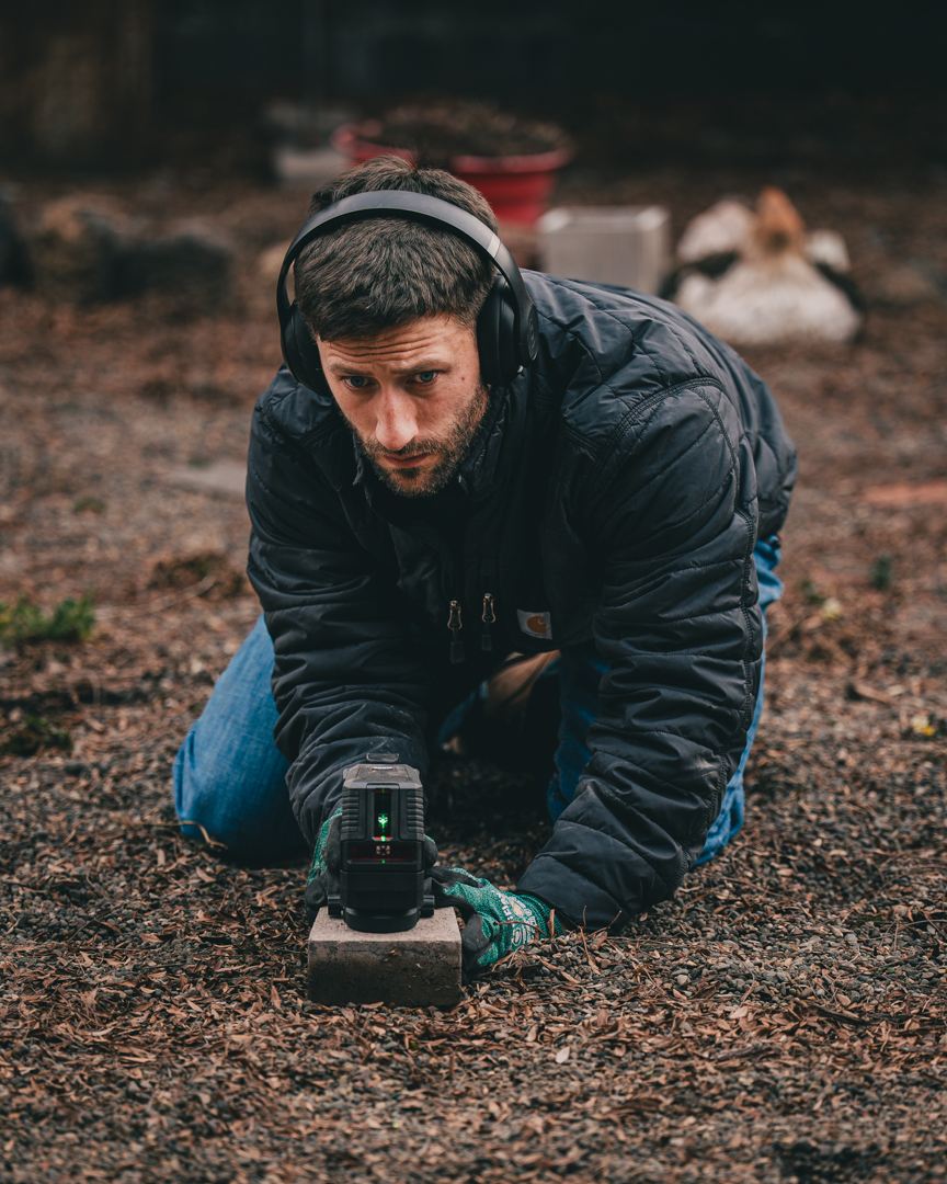 Chace leveling and preparing a hardscape base